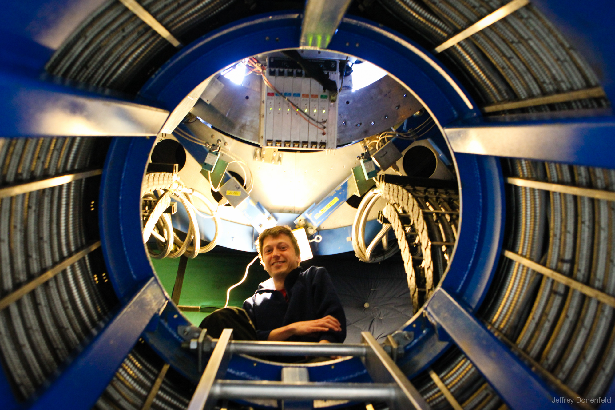Physicist Colin Bischoff inside the Keck Array telescope mount