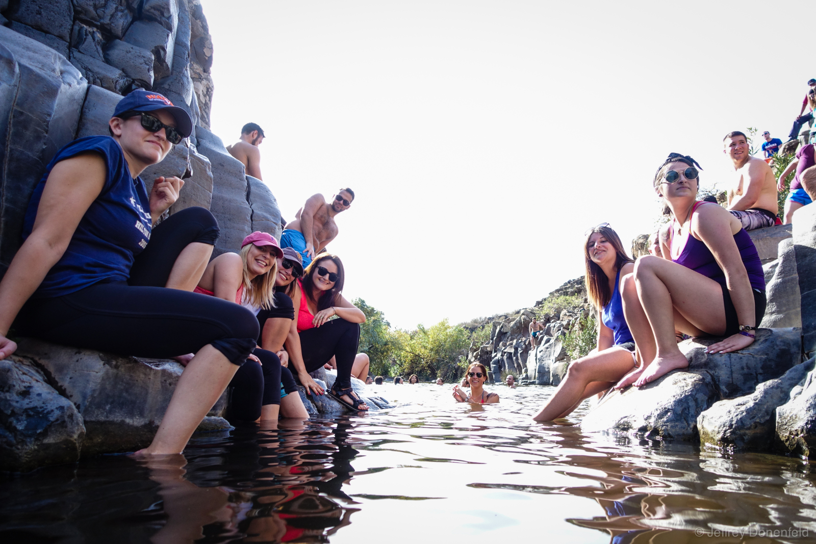Cooling off in one of the swimming holes along the Yehudiya Canyon Trail, Golan Heights, Israel. This is one of many beautiful swimming holes in the area, flanked by hexagon-shaped basalt columns.