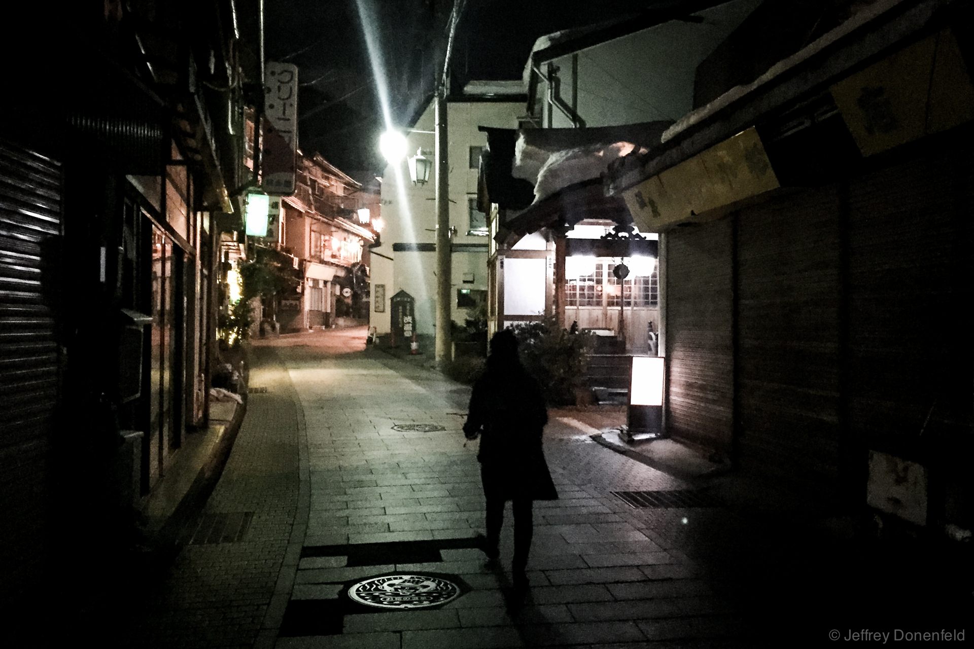 Walking through the streets of Shibu Onsen at night. The traditional town is beautifully old-worldly, with cobblestone streets and traditional houses. Also, streams of geothermally heated onsen water  bubble from pipes and vents everywhere.
