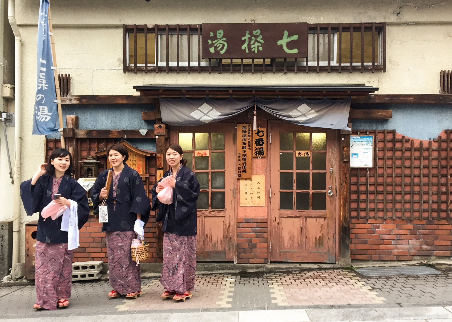 The onsen path is popular, and people show up in all sorts of nice robes. You can also see these women are wearing the traditional wodden onsen flip flops. They're not super comfortable, but it is possible to walk around town in them. The two wood bars on the bottom facilitate a rocking motion when walking.